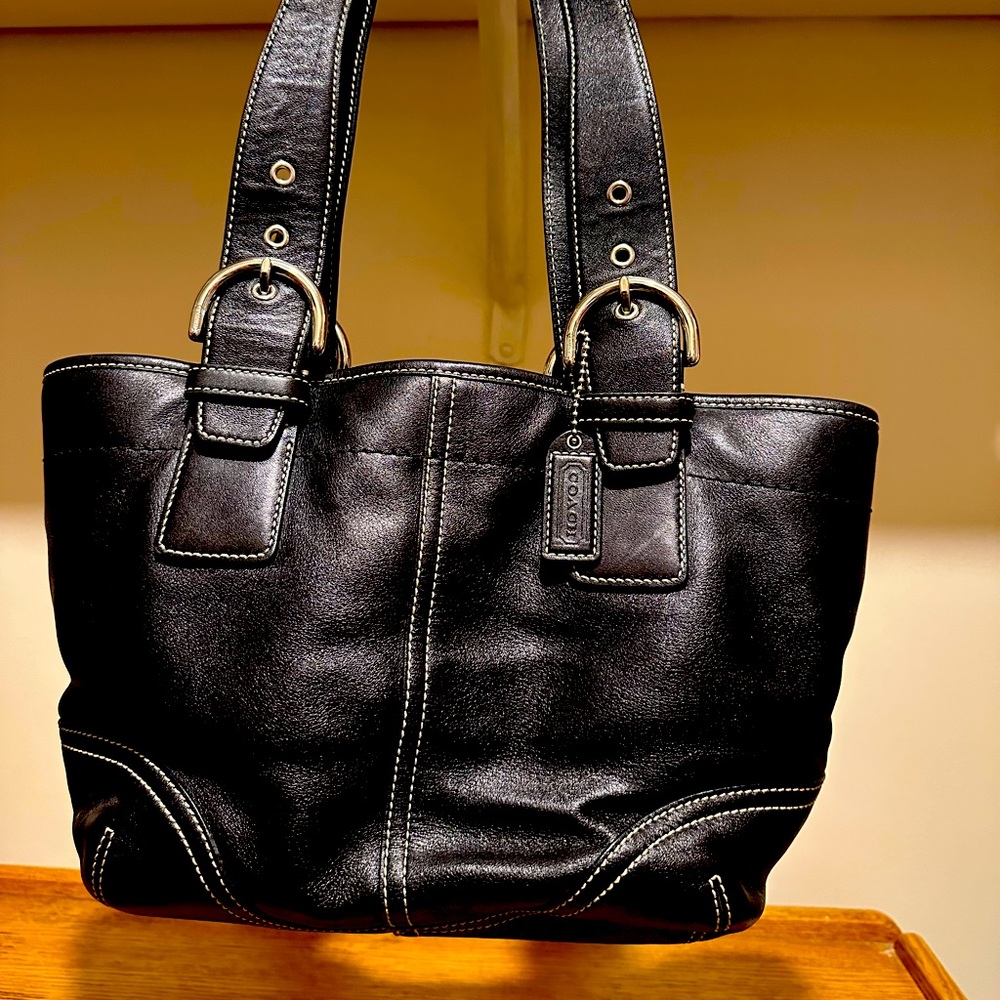 Coach brand black leather purse with dust bag with hang tag.